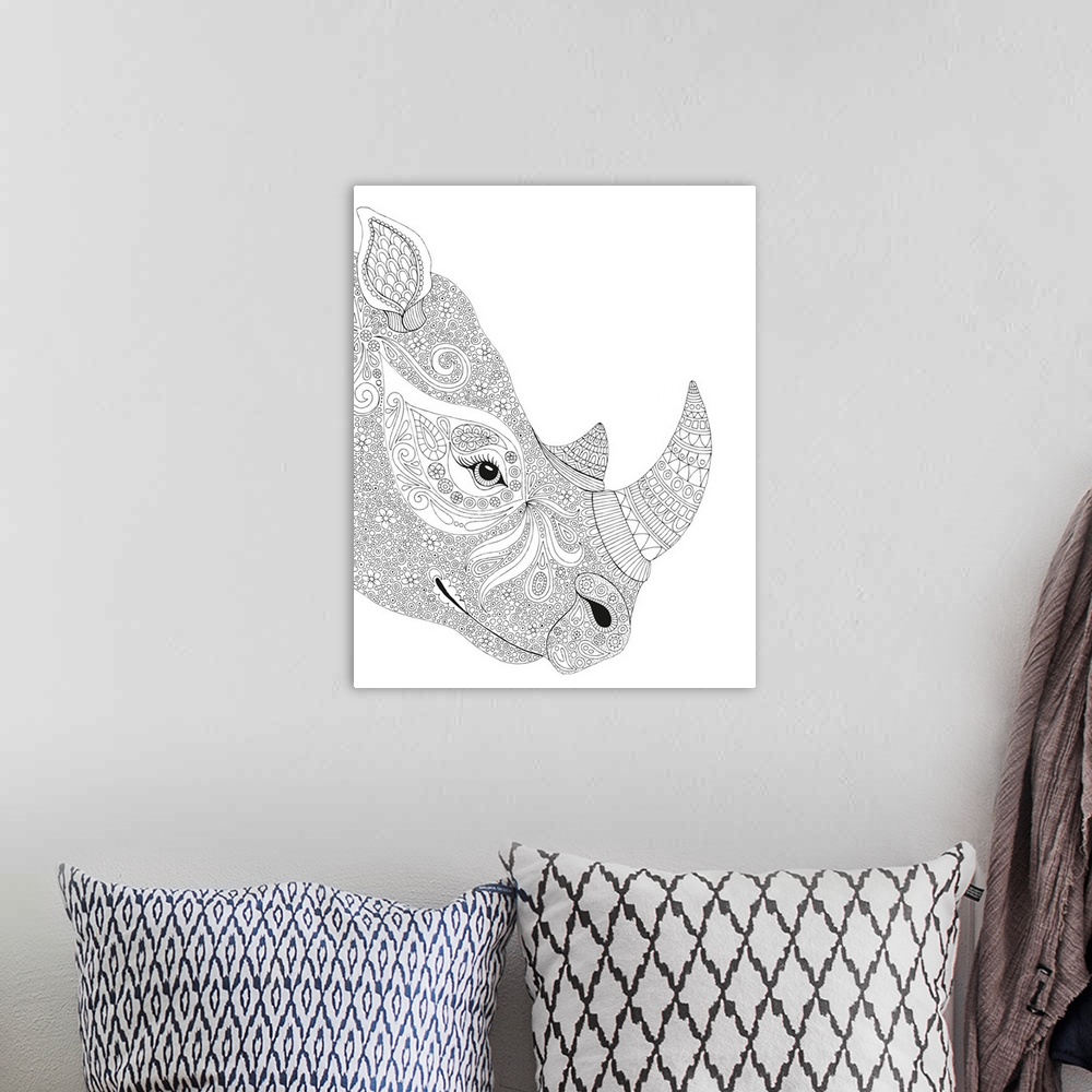 A bohemian room featuring Black and white line art of an intricately deigned rhinoceros face.
