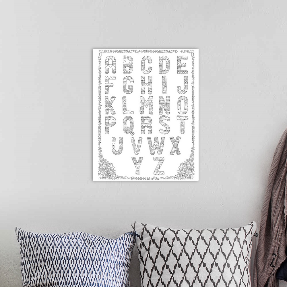 A bohemian room featuring Black and white line art of the alphabet with each letter intricately designed with a pattern.