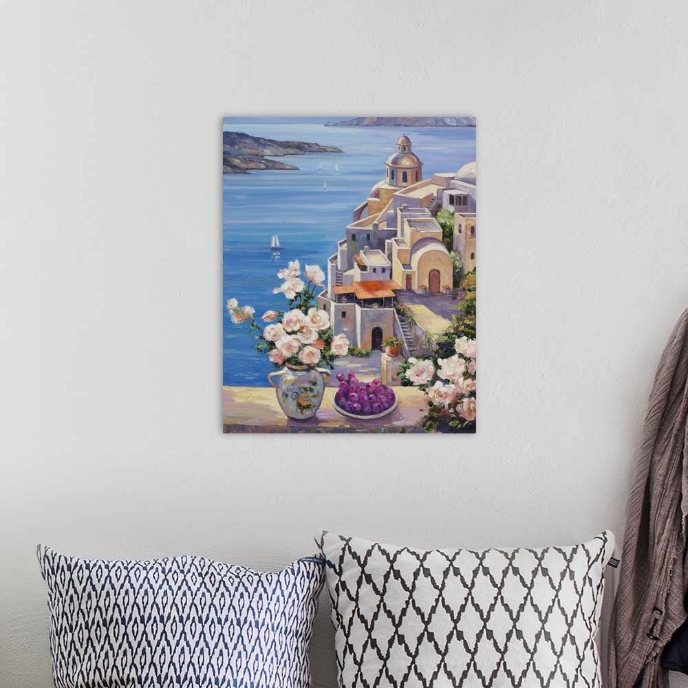 A bohemian room featuring A seascape with a rose arrangement in the foreground.