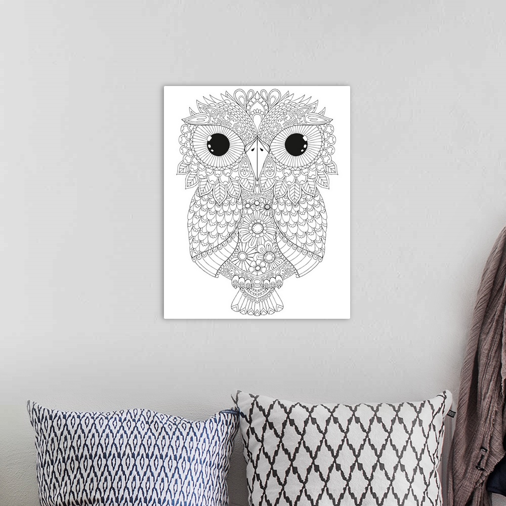 A bohemian room featuring Black and white line art of an intricately designed owl with big eyes.