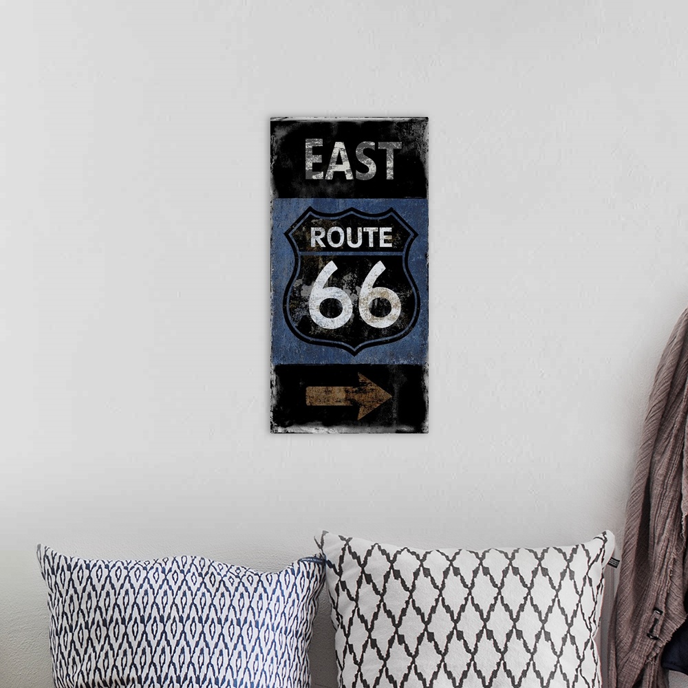 A bohemian room featuring East Route 66 vintage sign in black, white, blue, and copper.