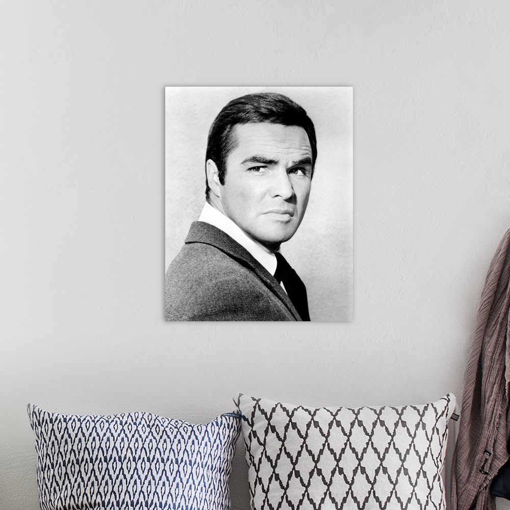 A bohemian room featuring Vintage black and white photograph of TV actor Burt Reynolds.