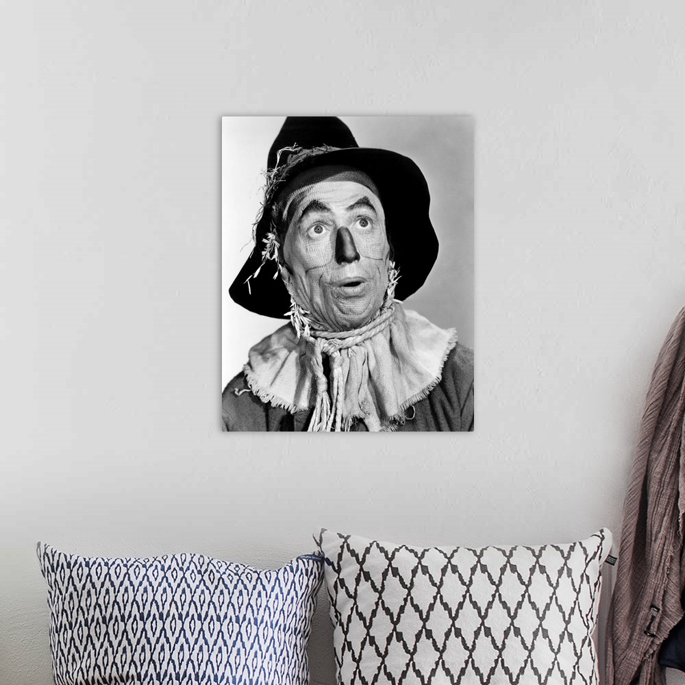 A bohemian room featuring THE WIZARD OF OZ, Ray Bolger in costume as the Scarecrow, 1939.