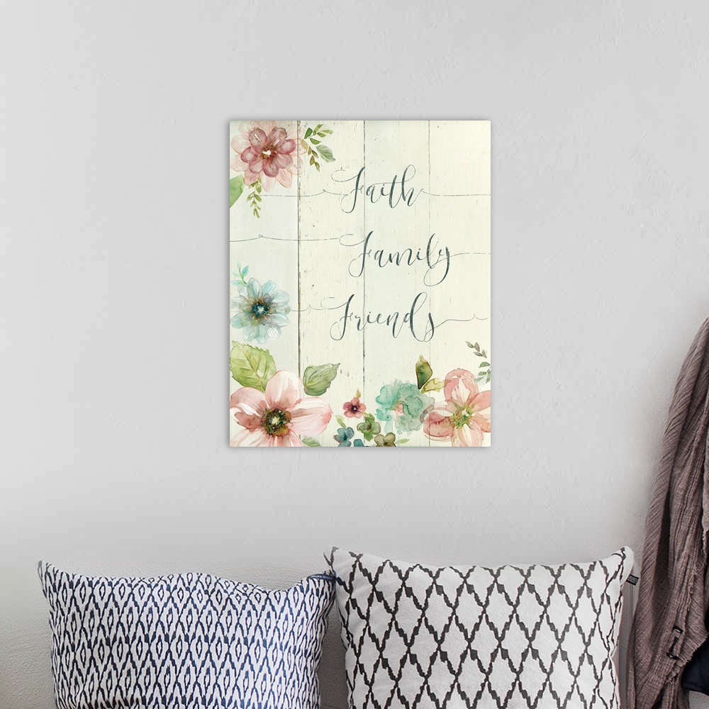 A bohemian room featuring Decorative watercolor artwork of a group of flowers with the text "Faith Family Friends".