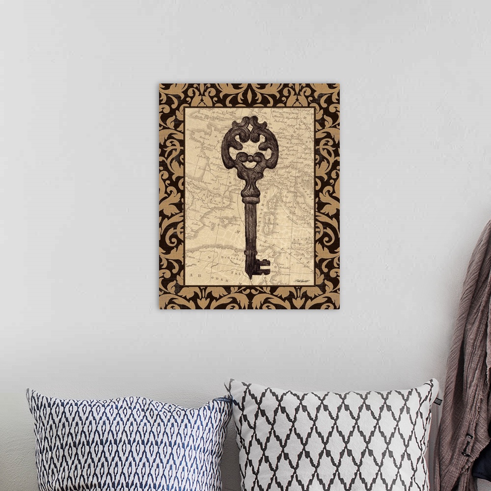 A bohemian room featuring Decor with an illustration of an antique skeleton key with a map in the background.