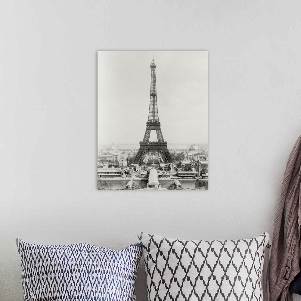 A bohemian room featuring Vintage black and white photograph of the Eiffel Tower.