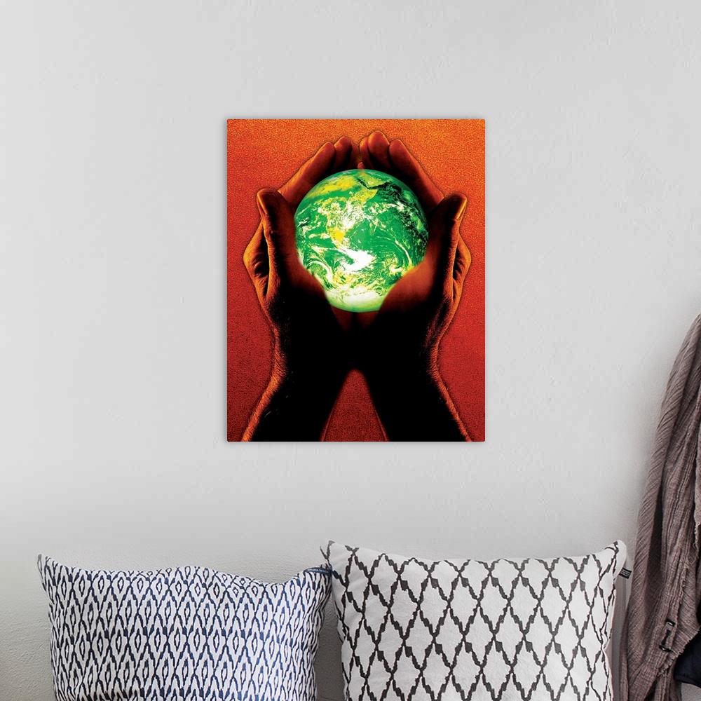 A bohemian room featuring Hands holding green earth, orange tone on hands and background