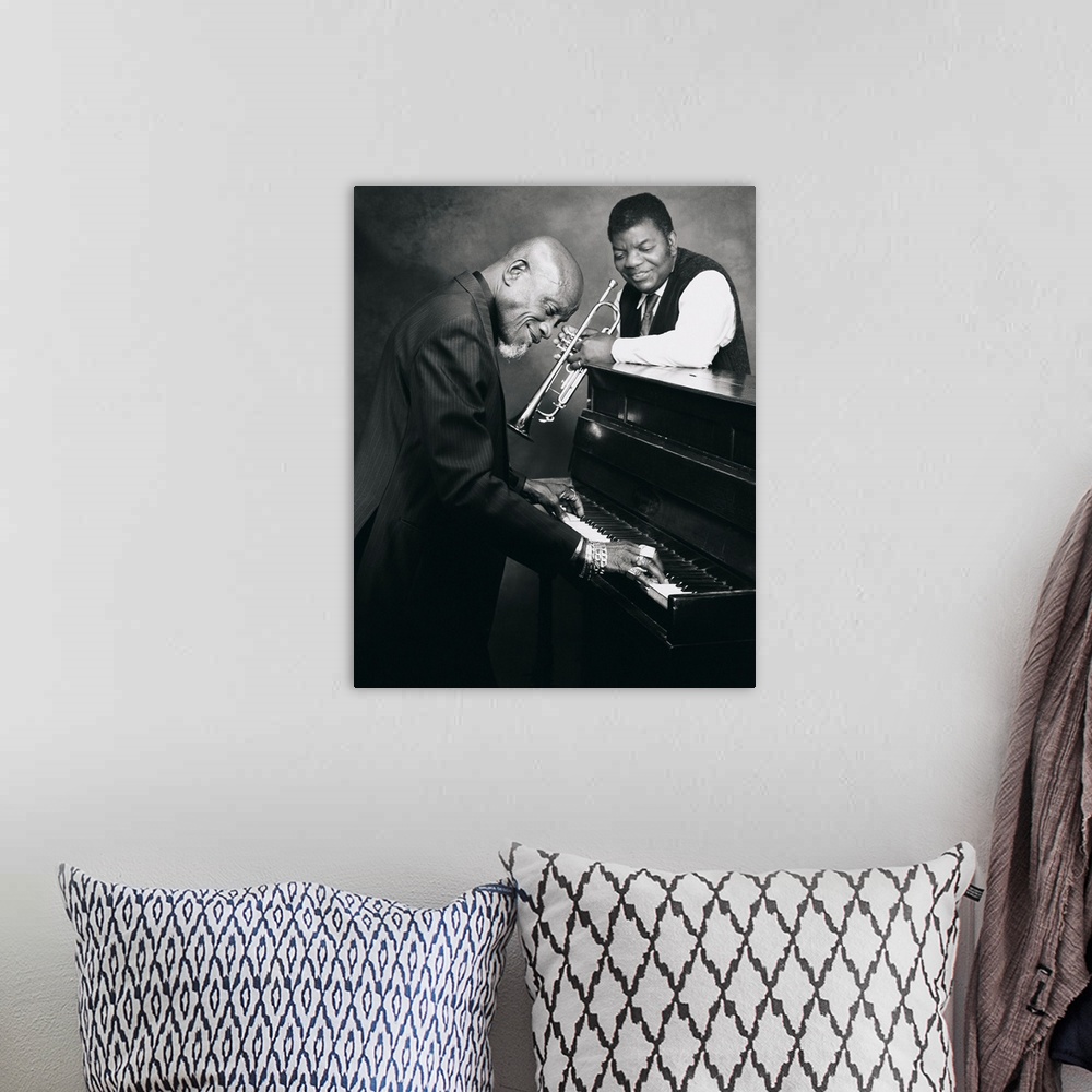 A bohemian room featuring Pianist and trumpet player talking together