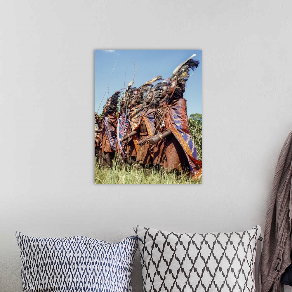 A bohemian room featuring Kenya, Kilgoris County,Lolgolrien. Maasai warriors dance during an eunoto ceremony.