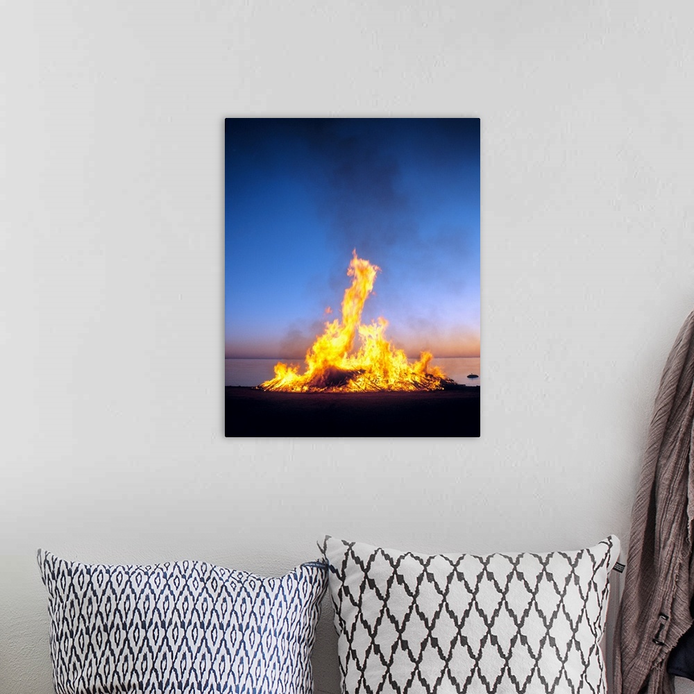 A bohemian room featuring Fire on the beach, gotland island, sweden.