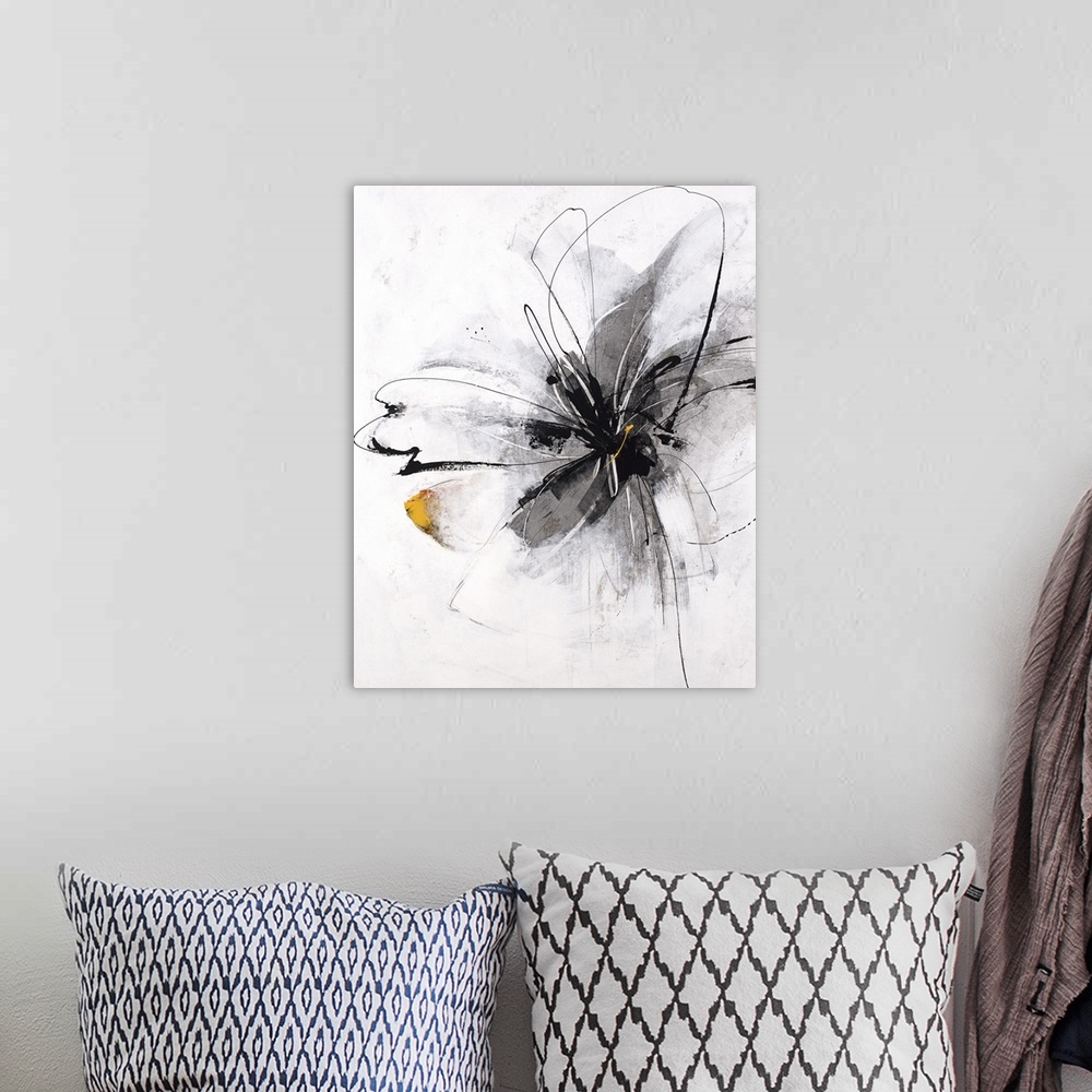 A bohemian room featuring Painting of a single flower in bloom in gray.