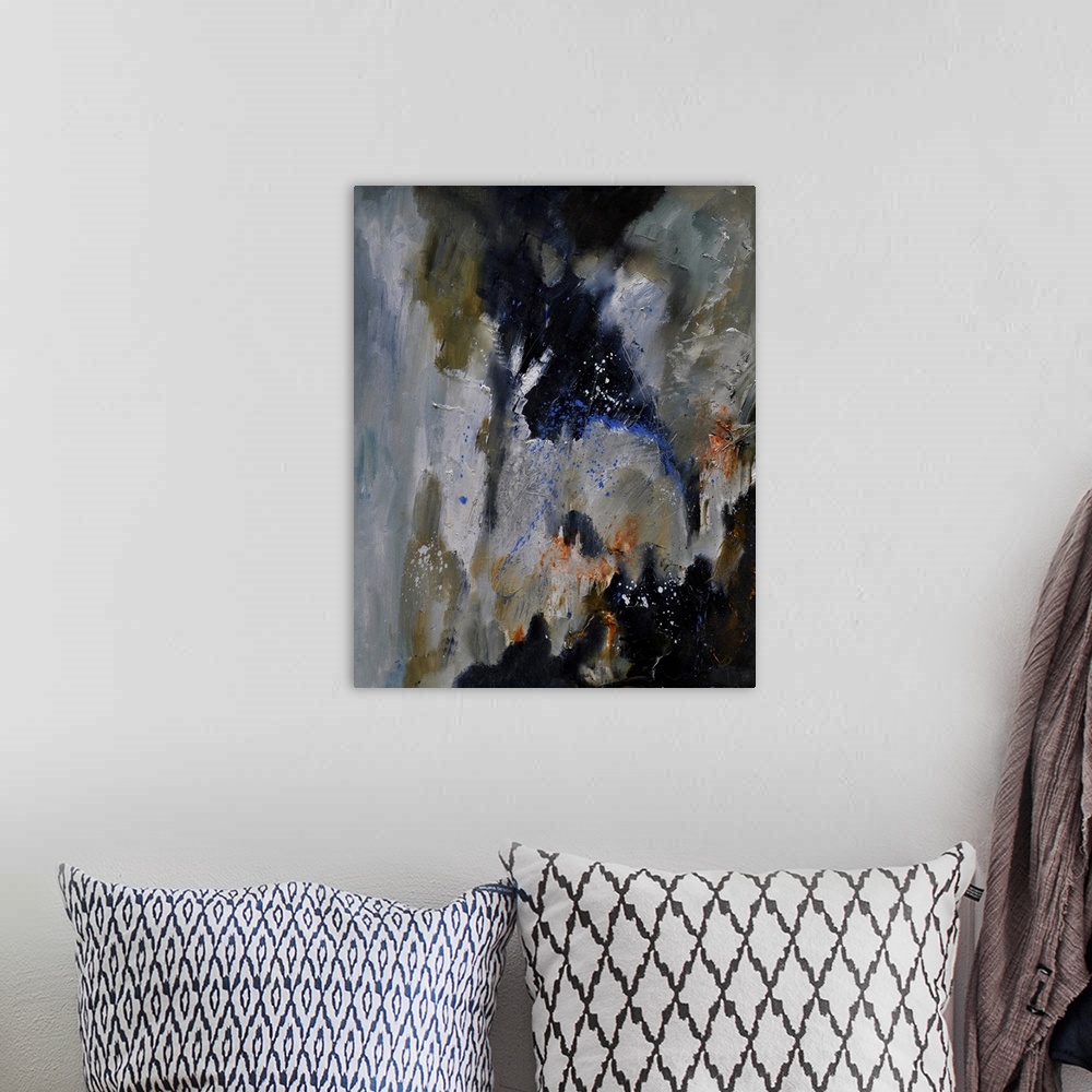 A bohemian room featuring Abstract painting of colors of gray, brown and blue with hints of orange in textured brush stroke...