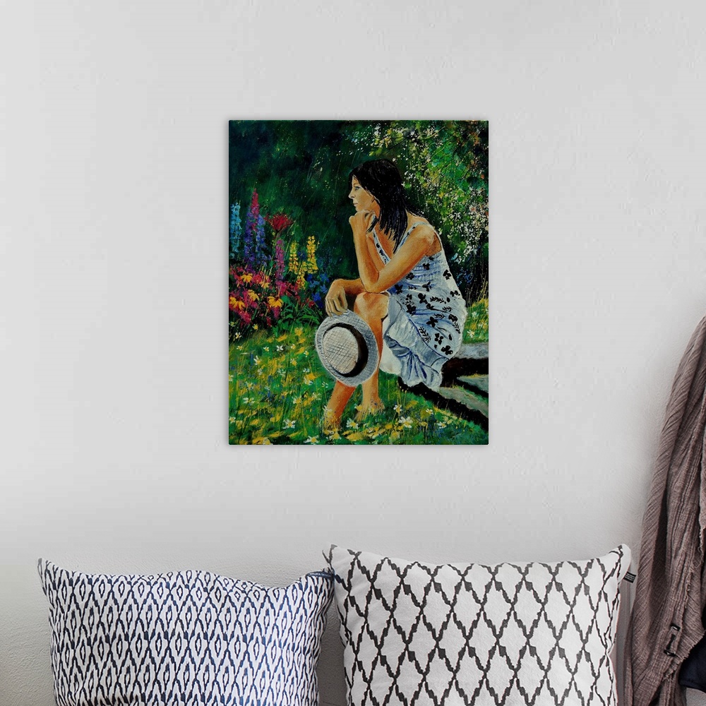 A bohemian room featuring Vertical portrait of a woman sitting in a garden full of blooming flowers in the spring.