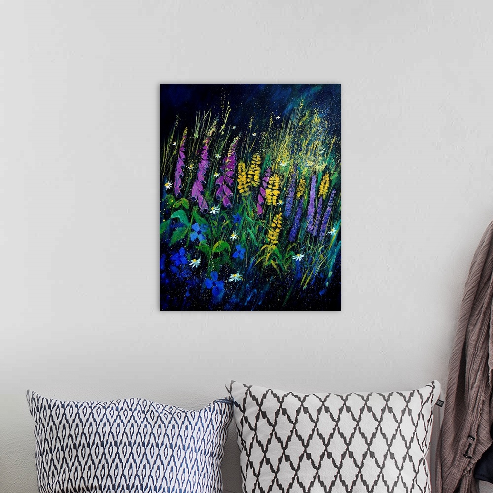 A bohemian room featuring A vertical painting of a large group of garden flowers on a dark backdrop.