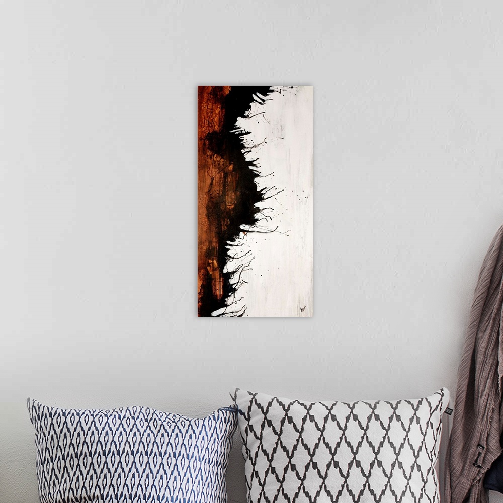 A bohemian room featuring Vertical panoramic painting of two contrasting colors separated by jagged ink splattered edge.