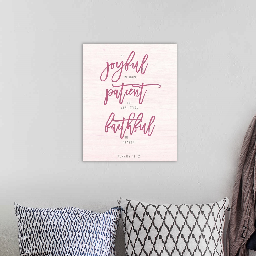 A bohemian room featuring A reminder of how to live well in hot pink lettering on a pale pink background.