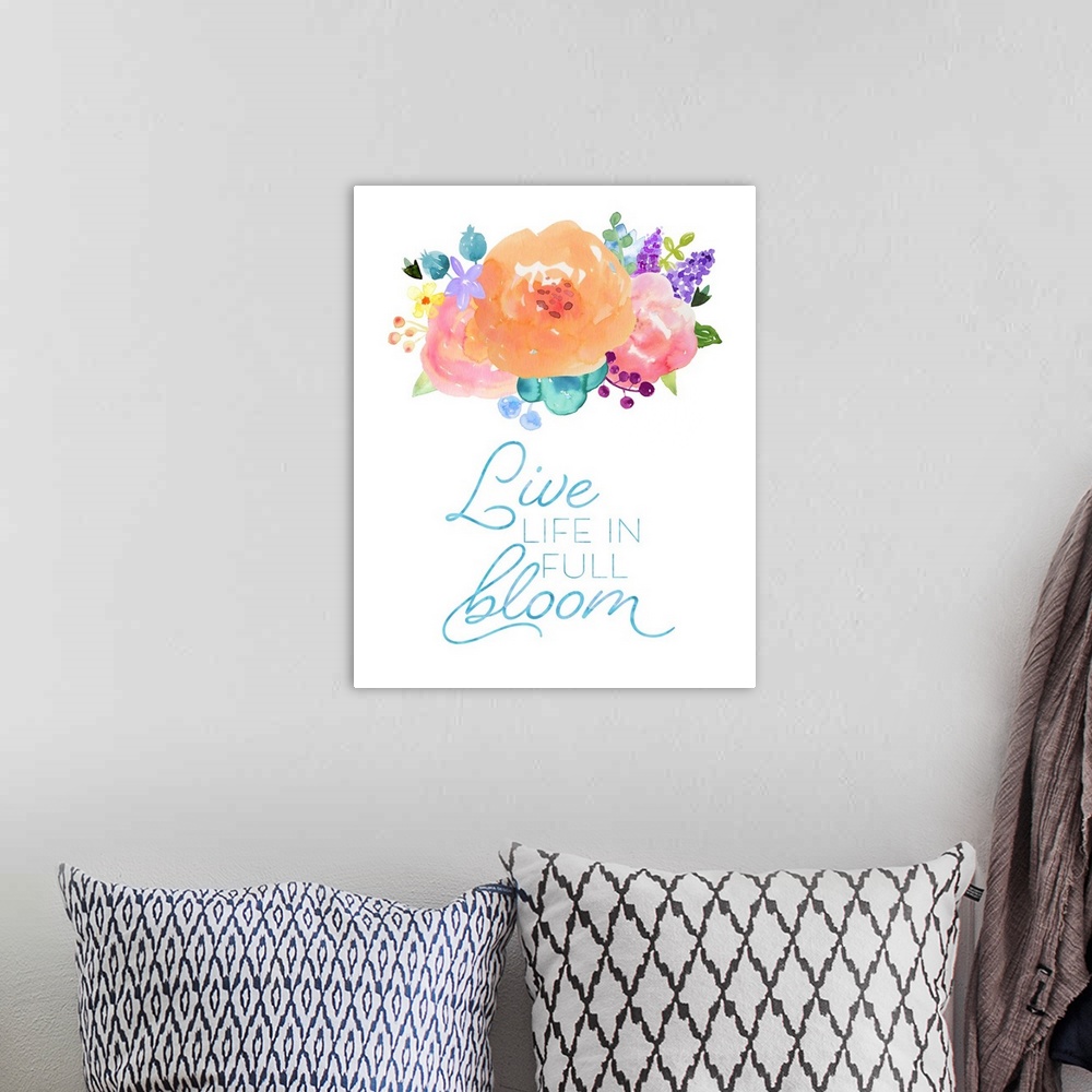 A bohemian room featuring "Live Life In Full Bloom" in blue with colorful watercolor flowers on a white background.