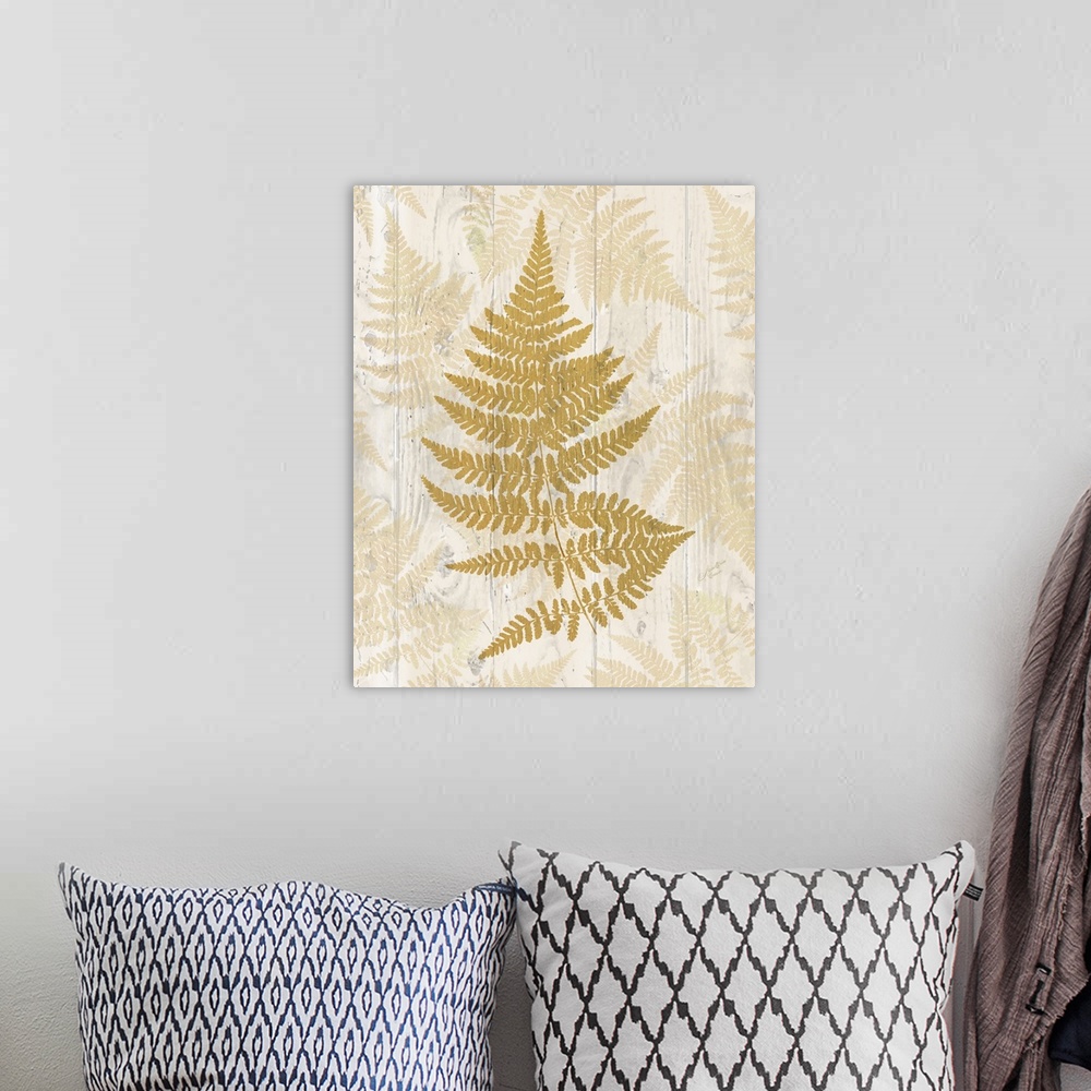 A bohemian room featuring Decorative artwork of a fern leaf with faded leaves on a wood plank background.