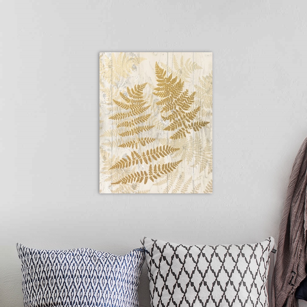 A bohemian room featuring Decorative artwork of fern leaves with faded leaves on a wood plank background.
