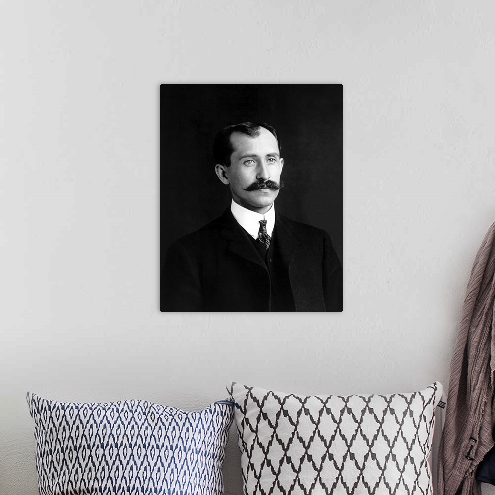 A bohemian room featuring Portrait of Orville Wright, dated 1905.