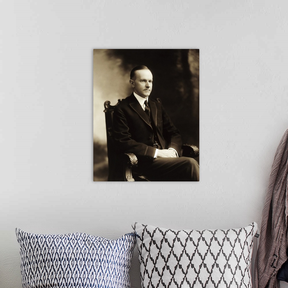 A bohemian room featuring Portrait of President Calvin Coolidge, dated 1919.