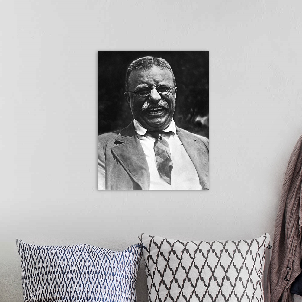 A bohemian room featuring Vintage portrait featuring a smiling Theodore Roosevelt, taken on May 3rd, 1921.
