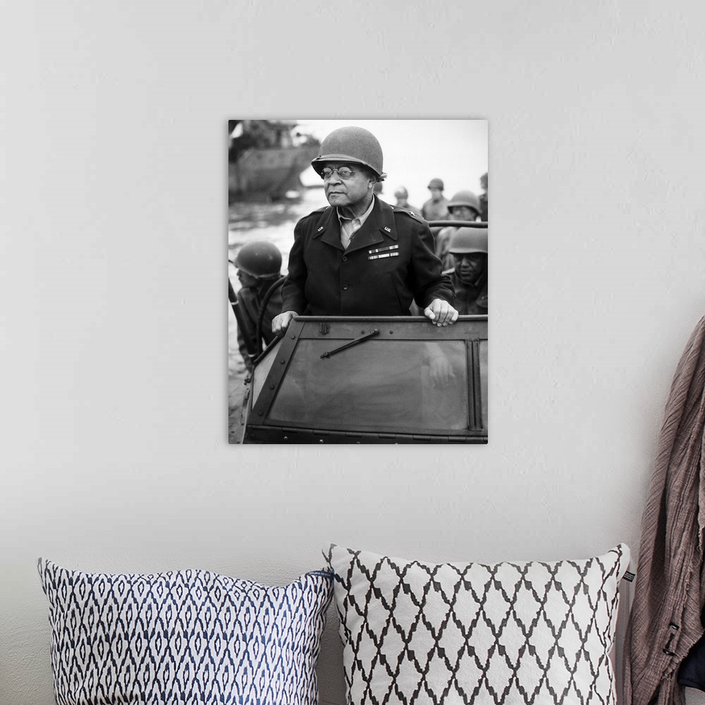 A bohemian room featuring World War II photograph of General Benjamin O. Davis overseeing troops in France.
