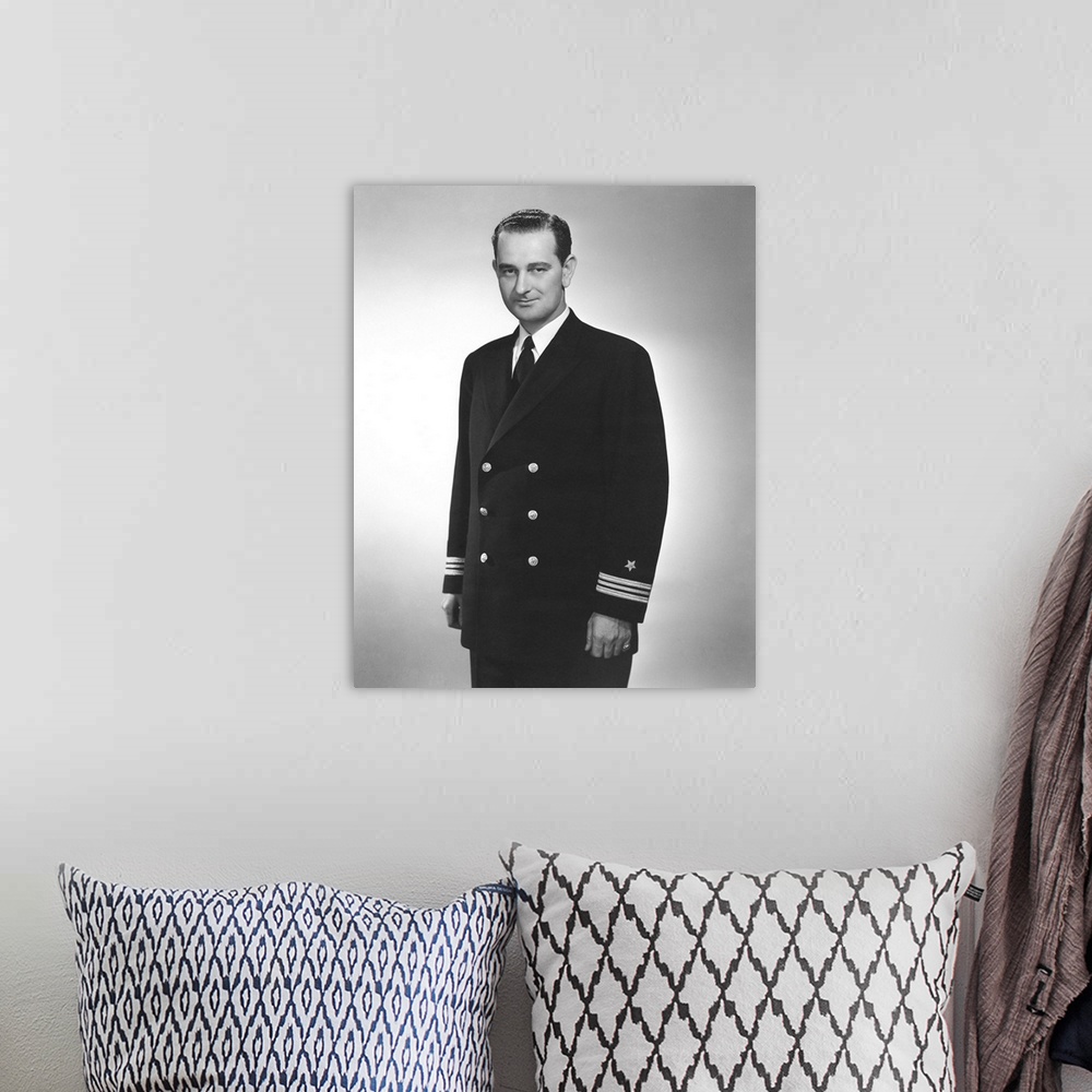 A bohemian room featuring World War II portrait of a young Lyndon Johnson in his naval uniform.