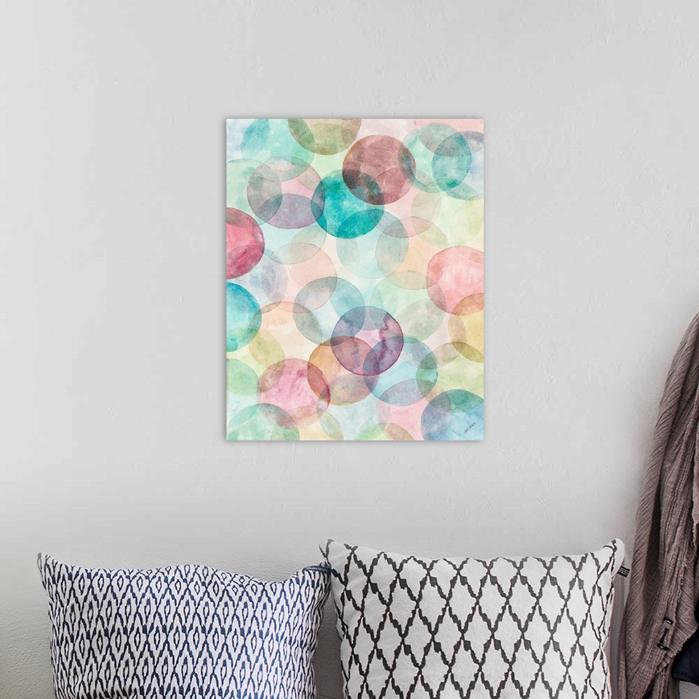 A bohemian room featuring A contemporary watercolor painting of colorful geometric circular shapes merging together.