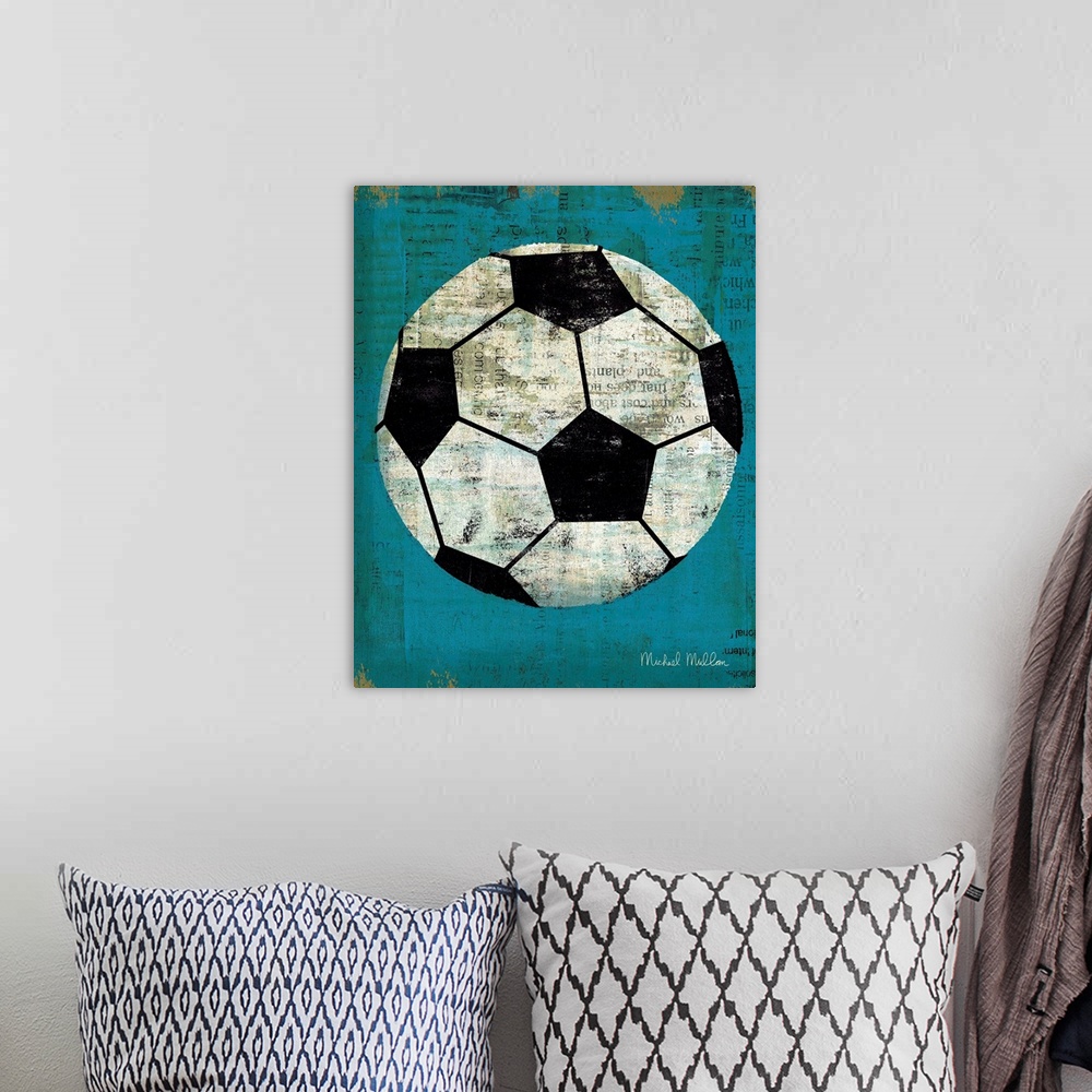 A bohemian room featuring Contemporary artwork of a soccer ball against a weathered blue background.