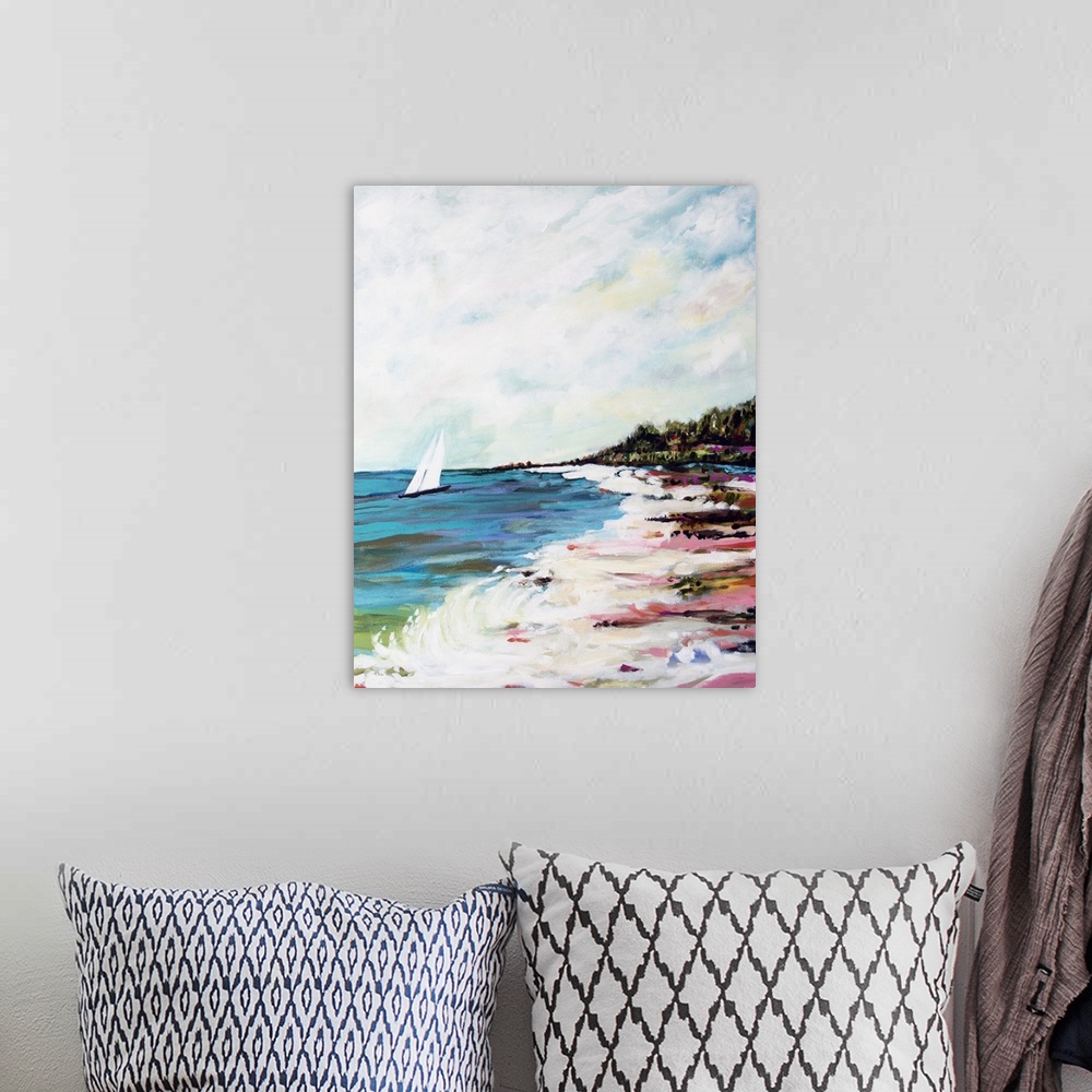 A bohemian room featuring Contemporary artwork of ocean waves on the beach, with a sailboat in the distance.