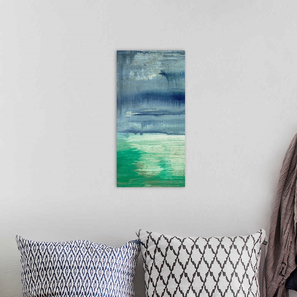 A bohemian room featuring An abstracted painting of a waterscape with cool, blue tones.