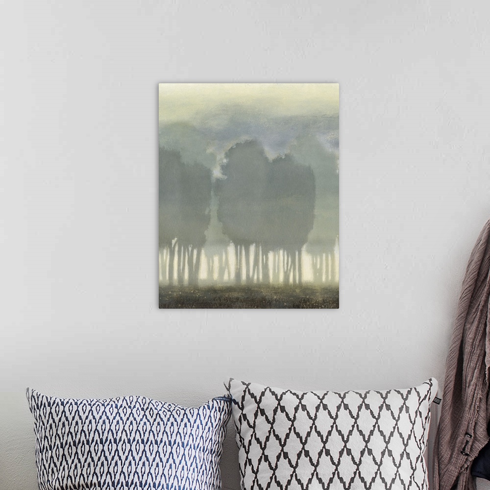 A bohemian room featuring Artwork of silhouetted trees in a foggy landscape.