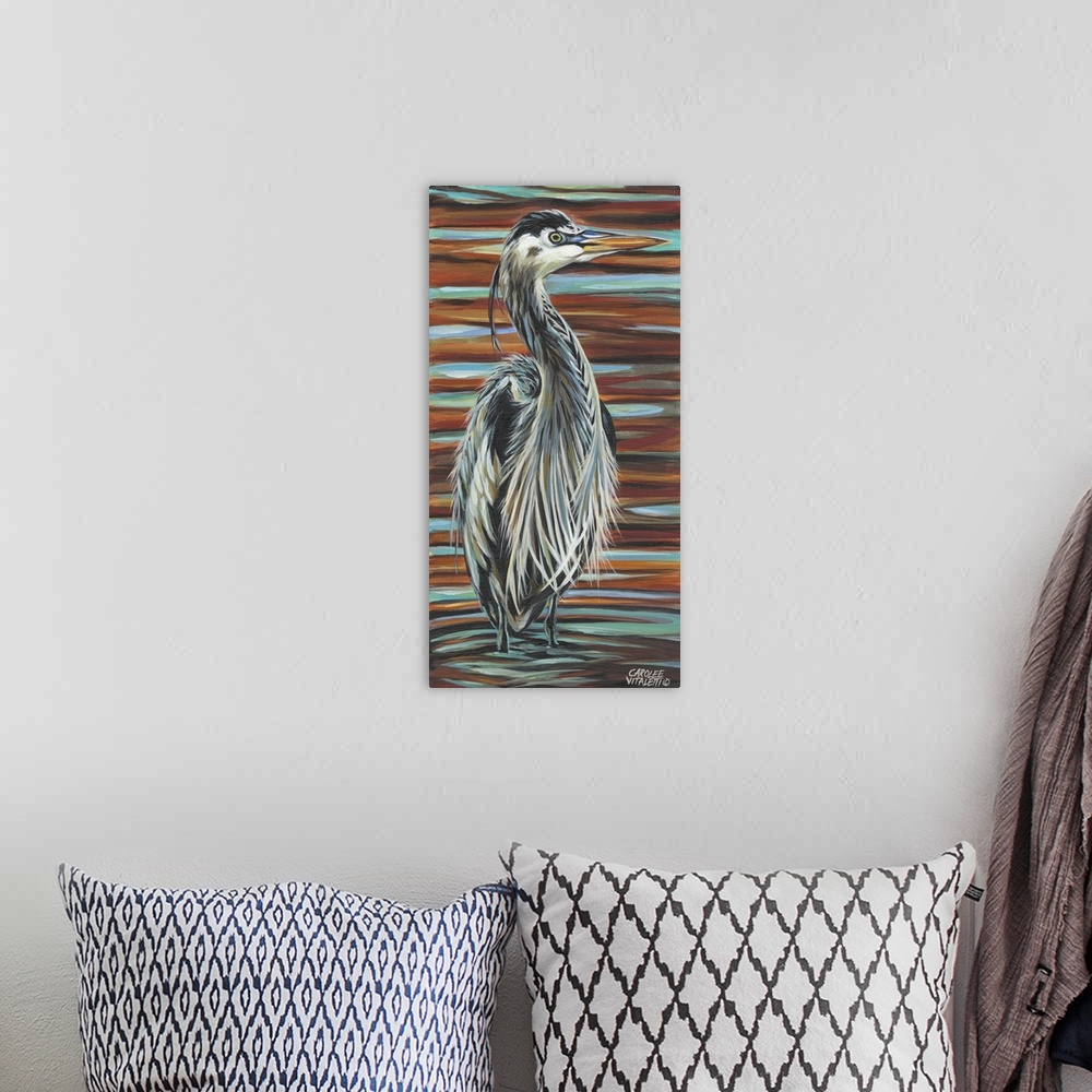 A bohemian room featuring Artwork of a Great Blue Heron with fluffed up feathers standing in a shallow pond.