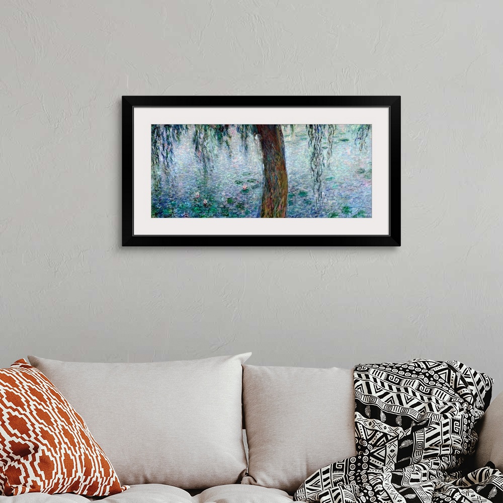A bohemian room featuring Panoramic classic art showcases a lone tree as it hangs over a pond littered with lily pads.