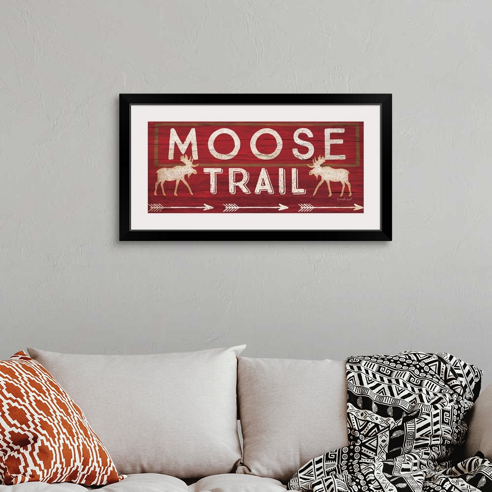 A bohemian room featuring Contemporary cabin decor artwork of a wooden sign for Moose Trail.
