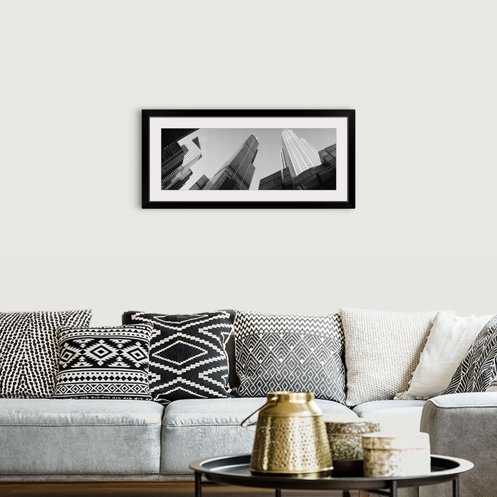 A bohemian room featuring View from the bottom looking up at big buildings in Chicago on canvas.