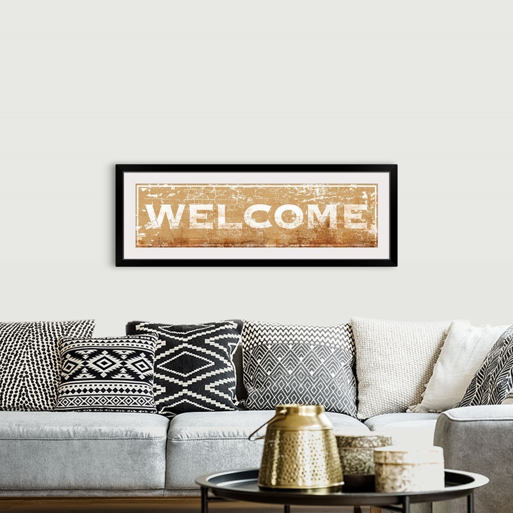 A bohemian room featuring Vintage rusty 1890's distressed trade sign wall art with typography reading WELCOME.