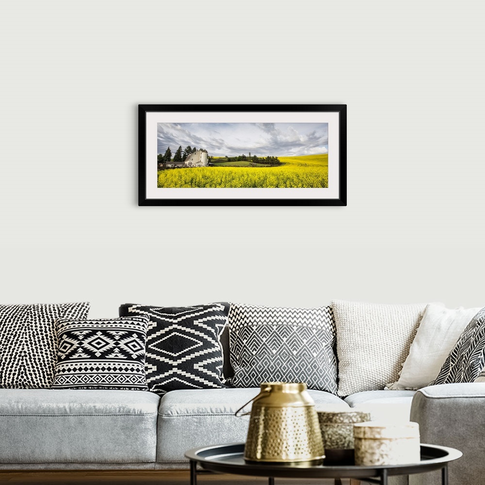 A bohemian room featuring The Dahmen Barn and yellow Cannola Fields in the Palouse, Washington