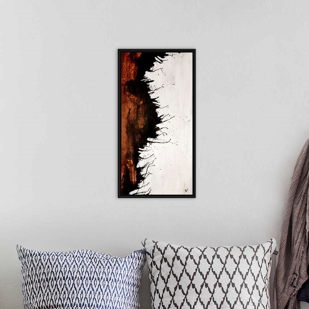 A bohemian room featuring Vertical panoramic painting of two contrasting colors separated by jagged ink splattered edge.