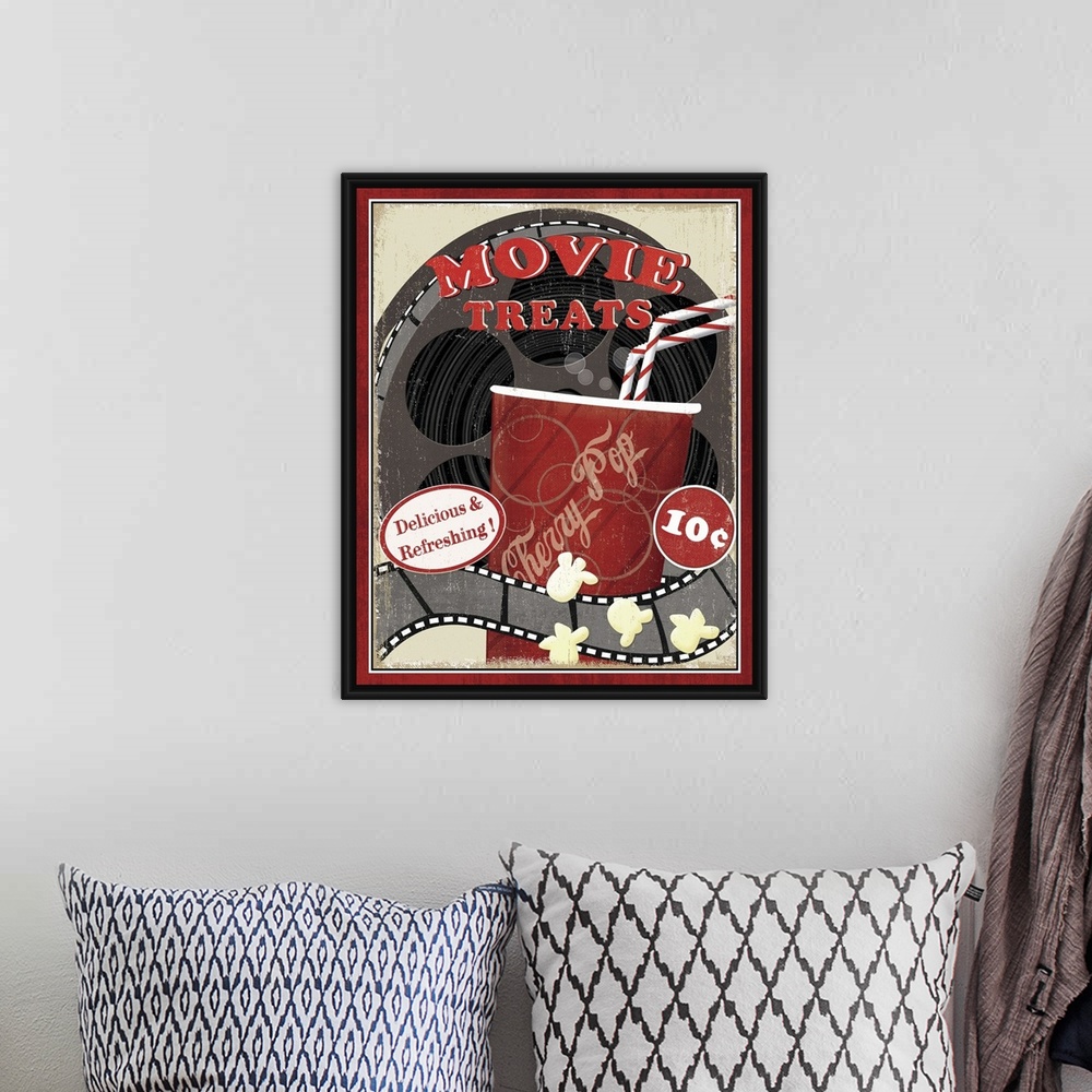 A bohemian room featuring A vintage poster of a movie reel with a cup of soda drawn in front of it and some kernels of popc...