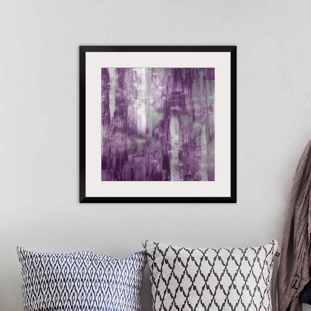 A bohemian room featuring Square abstract painting with silver and purple hues running down the canvas.