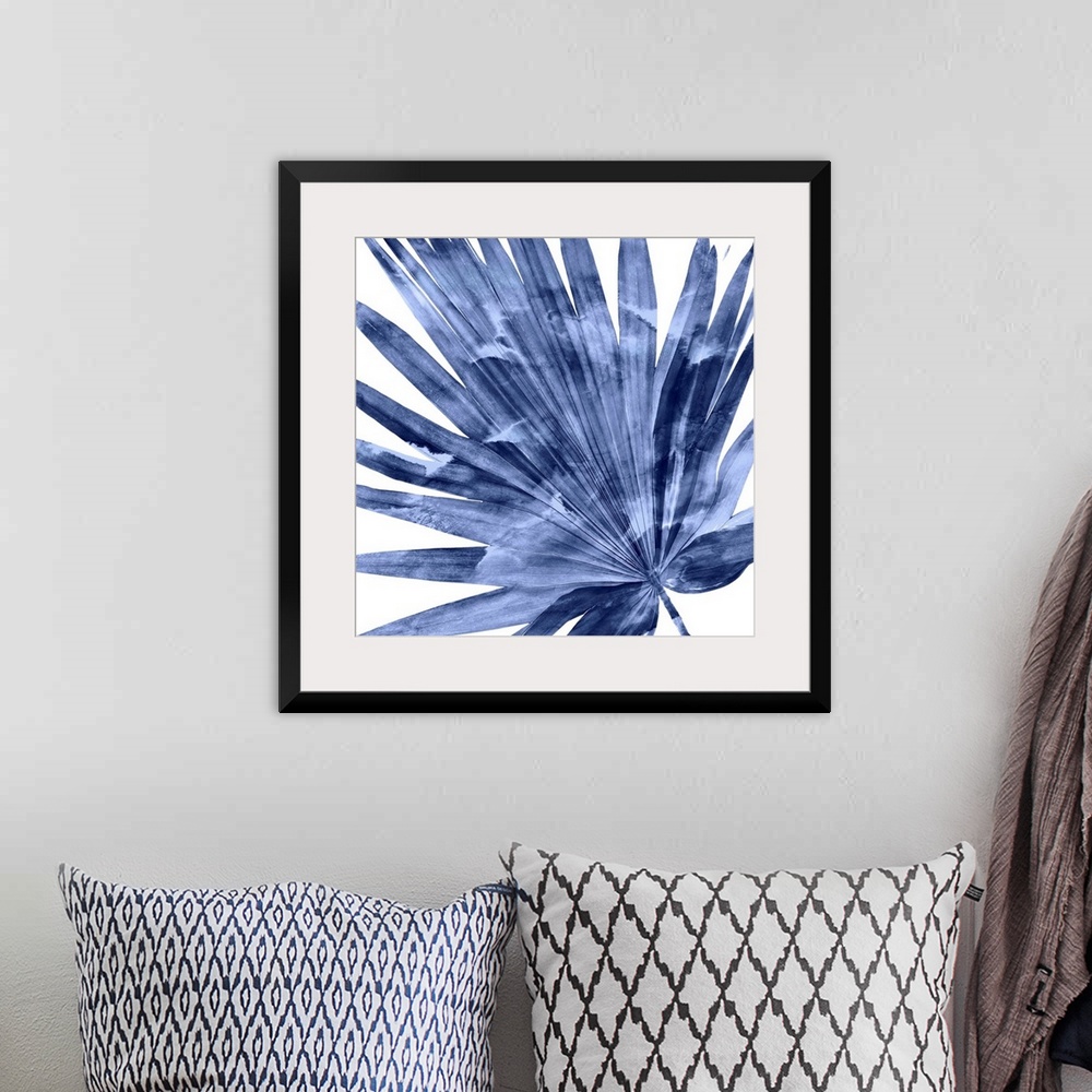 A bohemian room featuring Square decor with an indigo silhouette of a palm leaf on a solid white background.