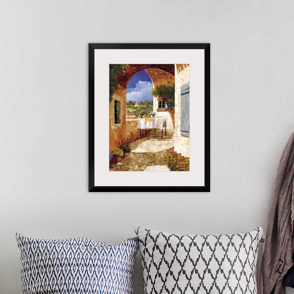 A bohemian room featuring Contemporary artwork of a Tuscan villa on a sunny day.