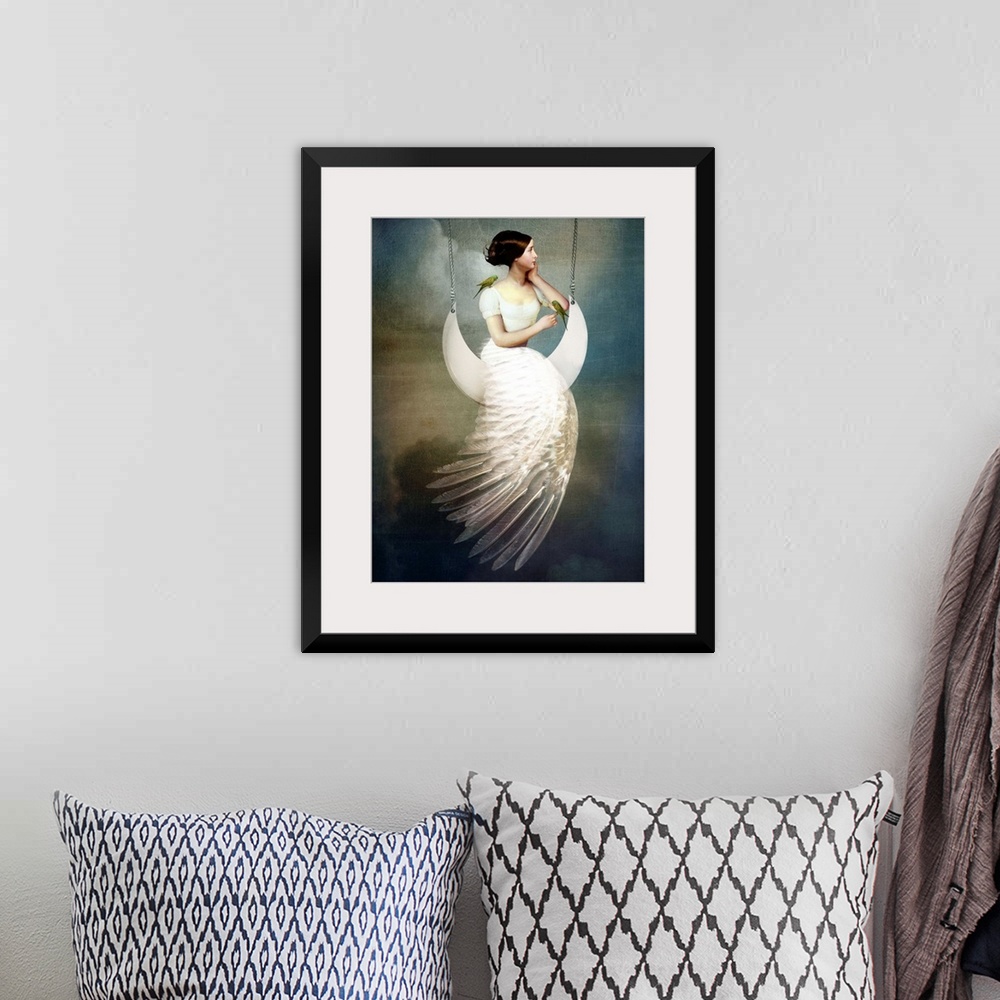 A bohemian room featuring A conceptual portrait of a female with a feather dress sitting on a moon swing.