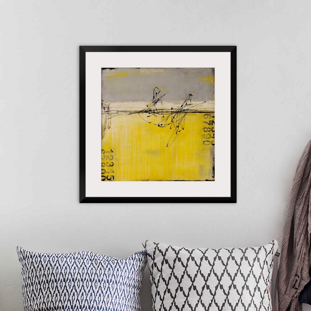 A bohemian room featuring A contemporary abstract painting using gray and yellow with stenciled numbers and thin dark black...