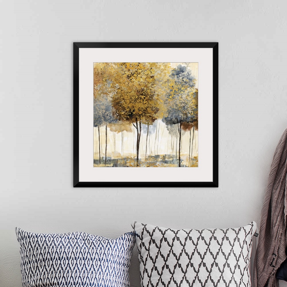 A bohemian room featuring Square decor with metallic gold and silver trees in an abstract forest.