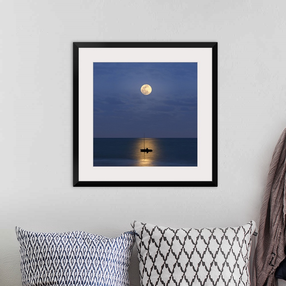 A bohemian room featuring Silhouette sailboat with moon
