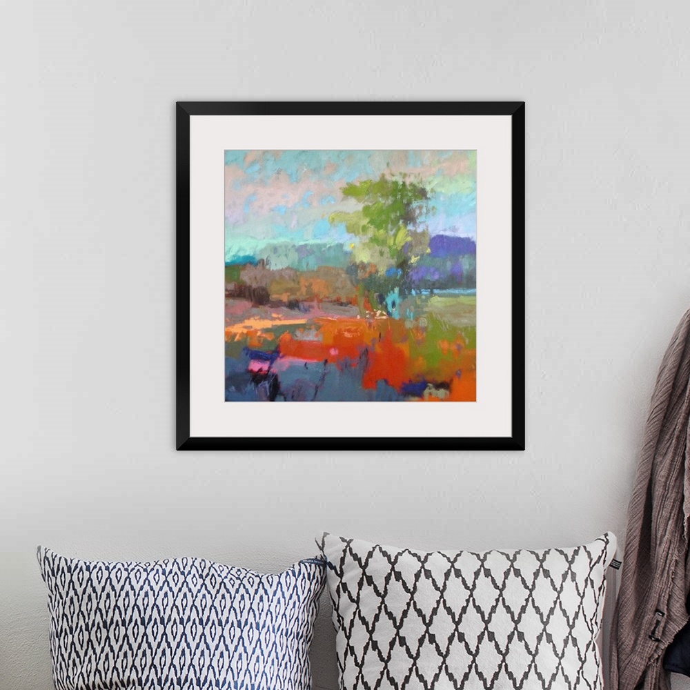 A bohemian room featuring A contemporary abstract painting using vibrant colors resembling a countryside landscape.