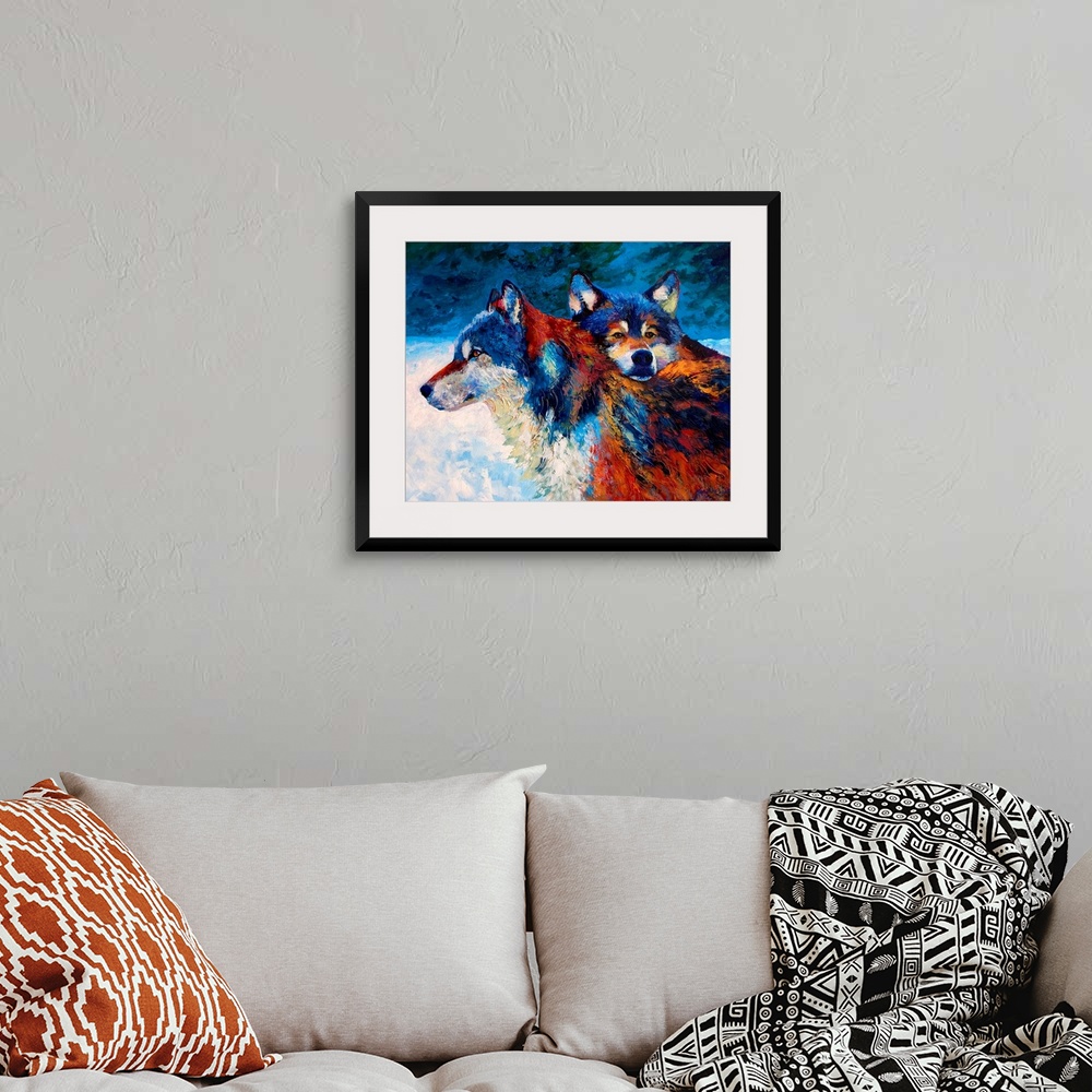 A bohemian room featuring Contemporary painting of two wolves in the snow at night.